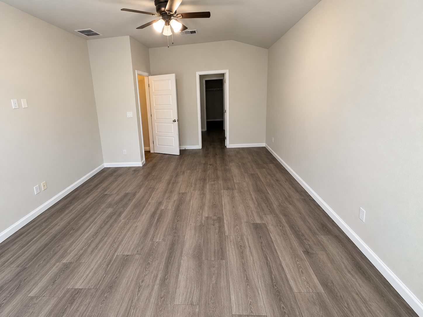 Bedroom after make-ready: new vinyl plank floor and fresh paint